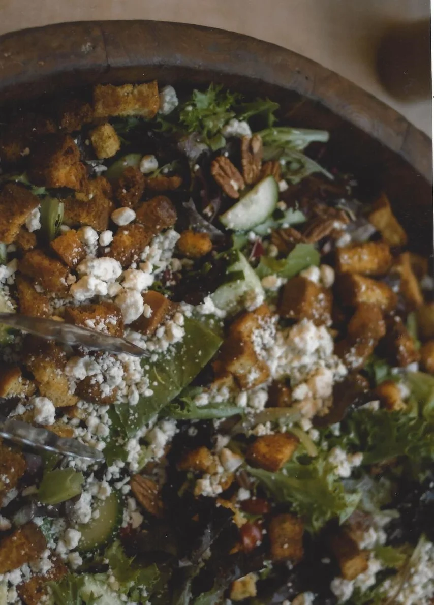 Mixed green salad with pecans and feta cheese