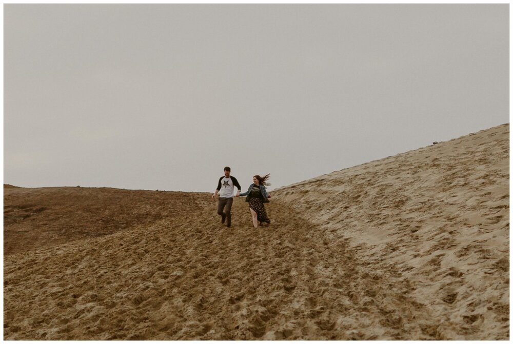 couple-running-sand-oregon-coast.jpg