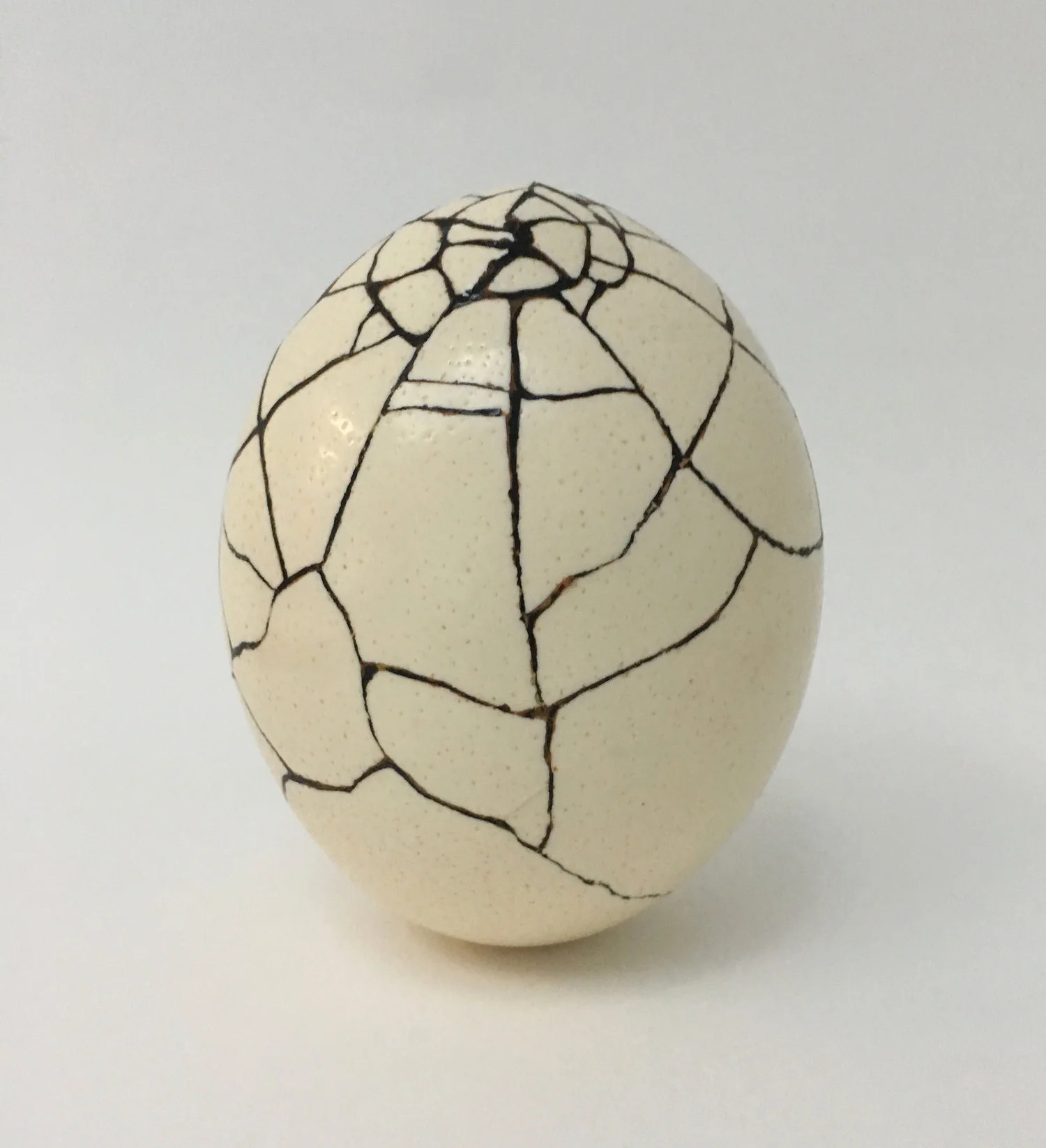 Repair , 2016, Ostrich egg, lacquer, sand, 6.5 x 5 inches
