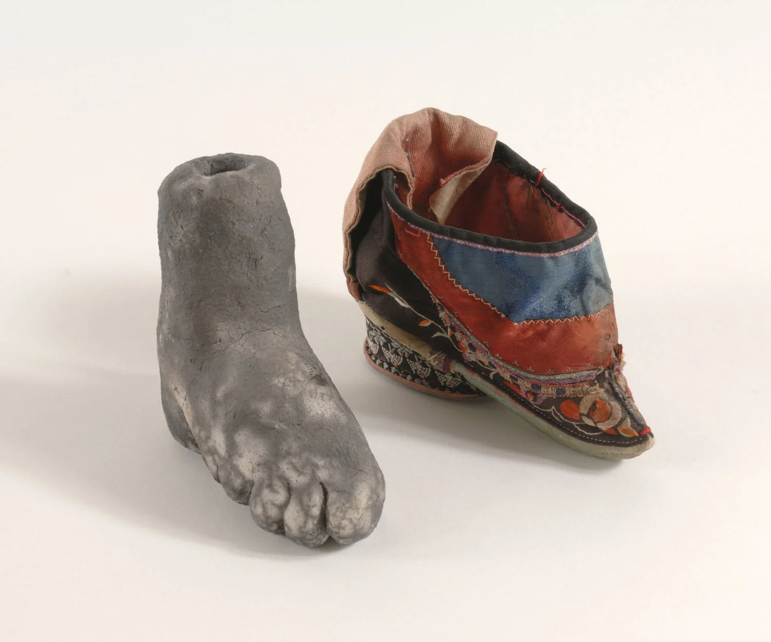 Bound to Please #34 , 2008, Raku fired ceramic and embroidered fabric, 4 x 4 x 2.25 inches each
