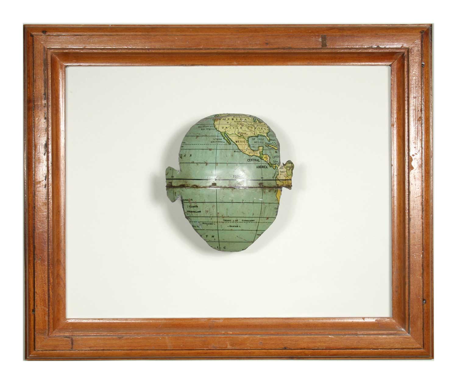 Untitled (framed face) , 2007, Salvaged frame and globe, 10.5 x 13 x 2.5 inches