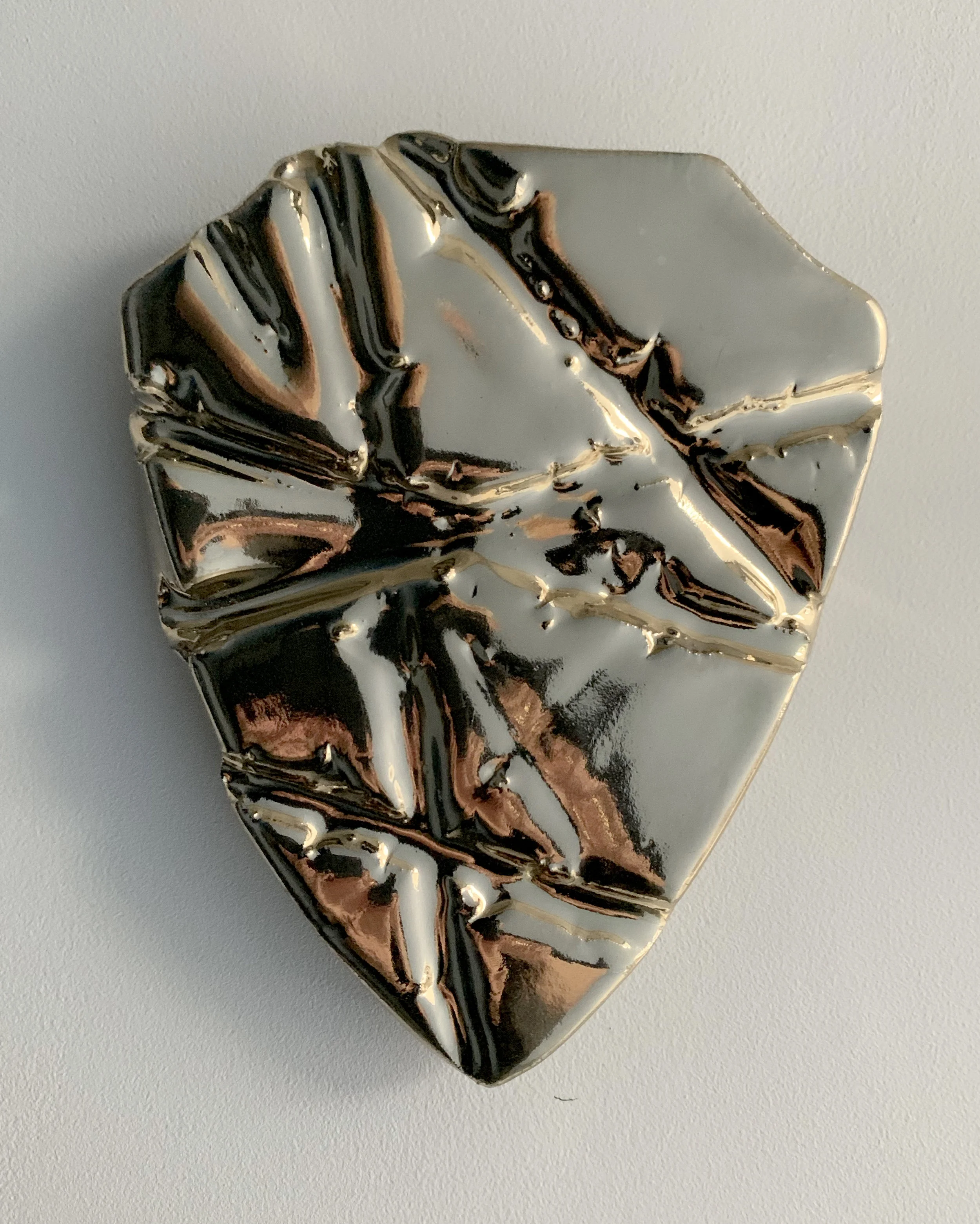 Untitled, 2019, Mirrored ceramic, 7 x 5.5 x .75 inches