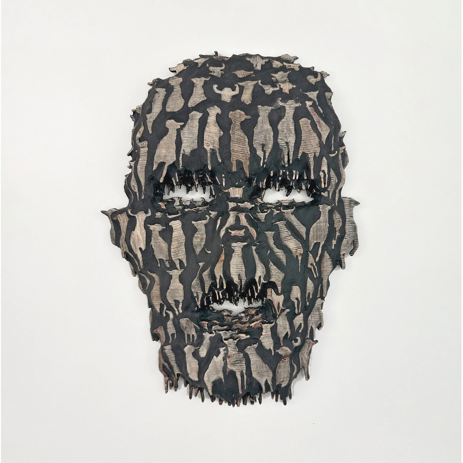 Migration, an artwork by Lorna Stevens in which a herd of animals forms a human face, surrounded and trapped by asphalt that interrupts their migratory paths.