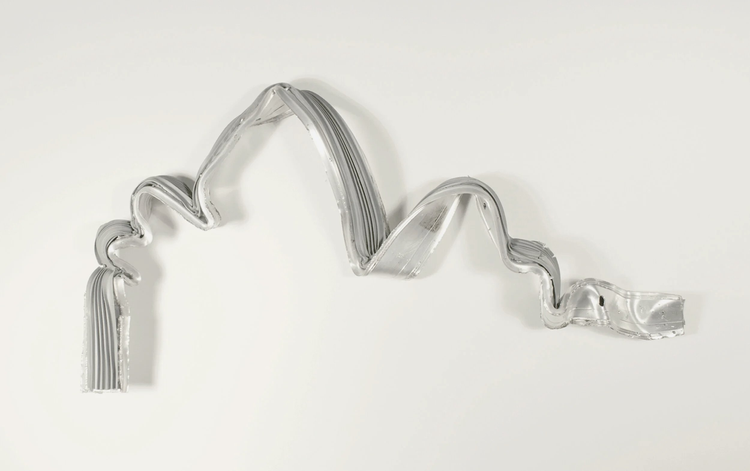 Brink, an artwork by Lorna Stevens made from a salvaged threshold shaped into a mountain range, suggesting human encroachment into the natural world.