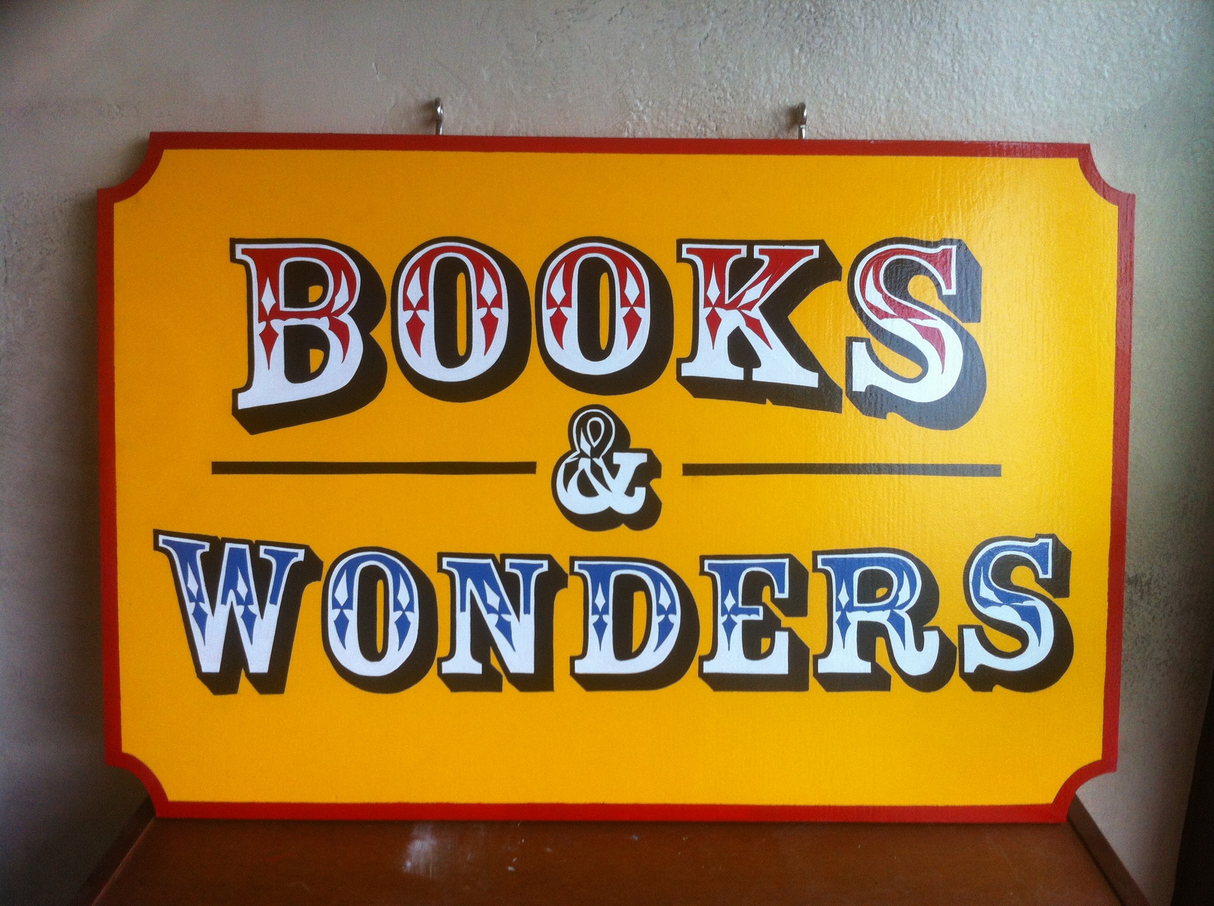 Books&WondersHangingSign.JPG