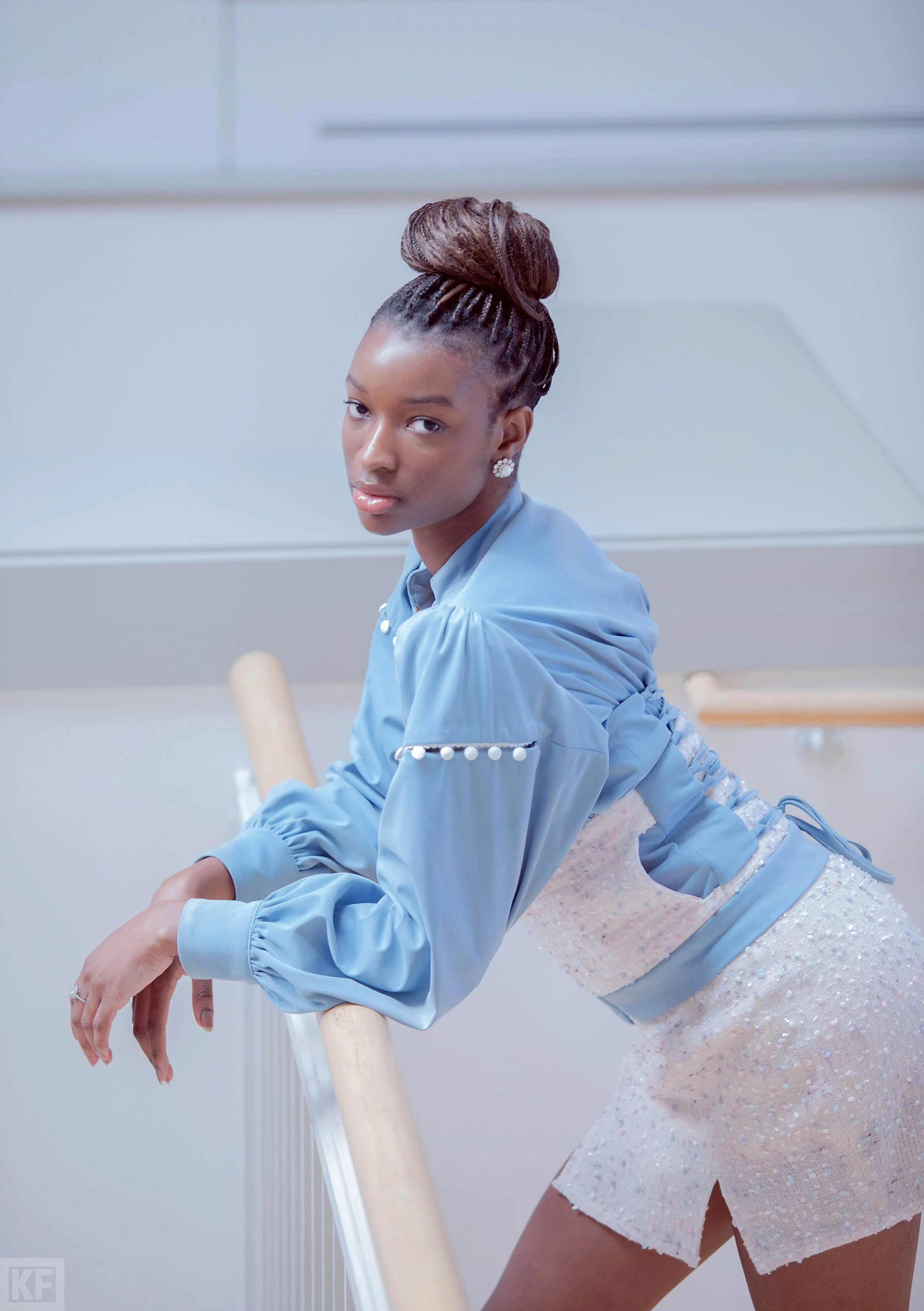 Tabitha-Fielteau-2026-Collection-suede-tweed-jacket-and tweed-skirt-over-balcony.jpg