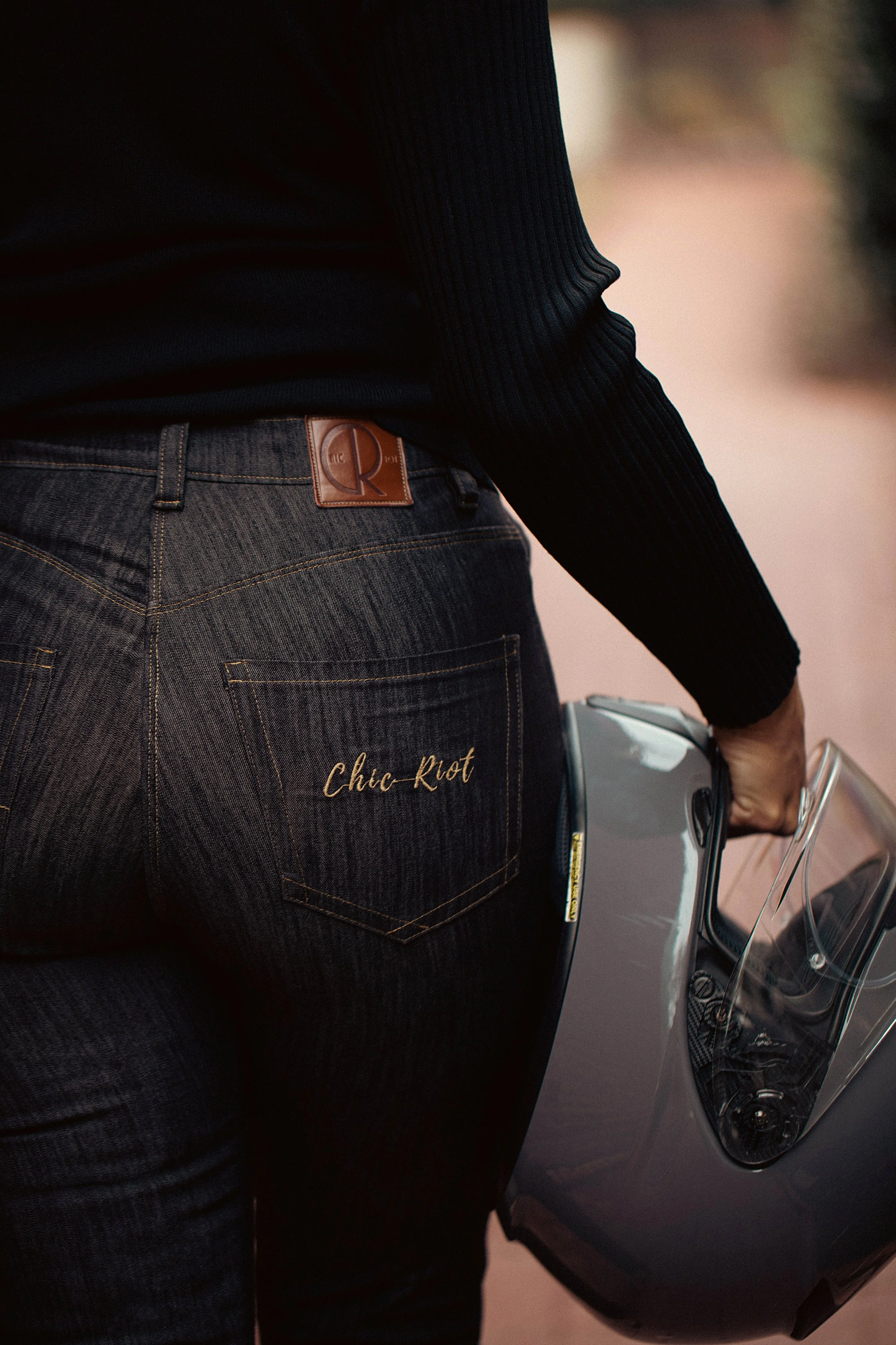 Chic-Riot-Irany-Brie-Moto-Jeans-Downtown-Alley-Duluth-With-Helmet-Back.jpg