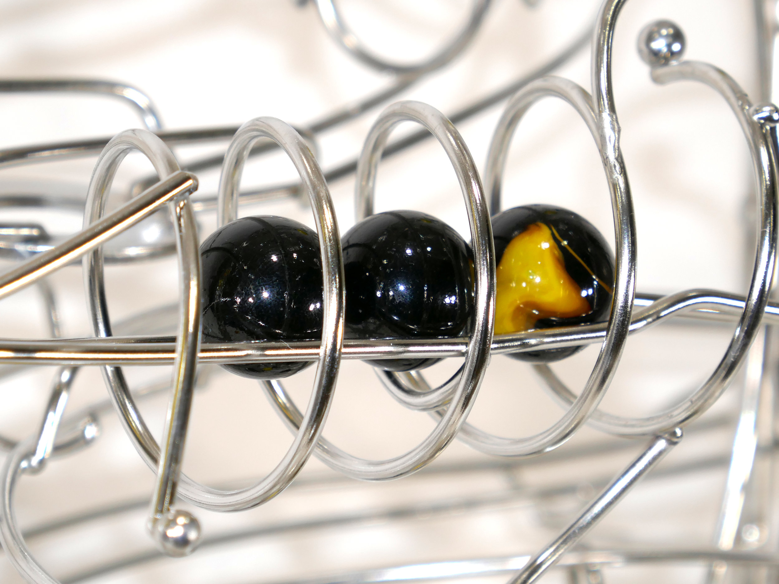 Rolling ball marble machine - close up of energy transfer kinetic element