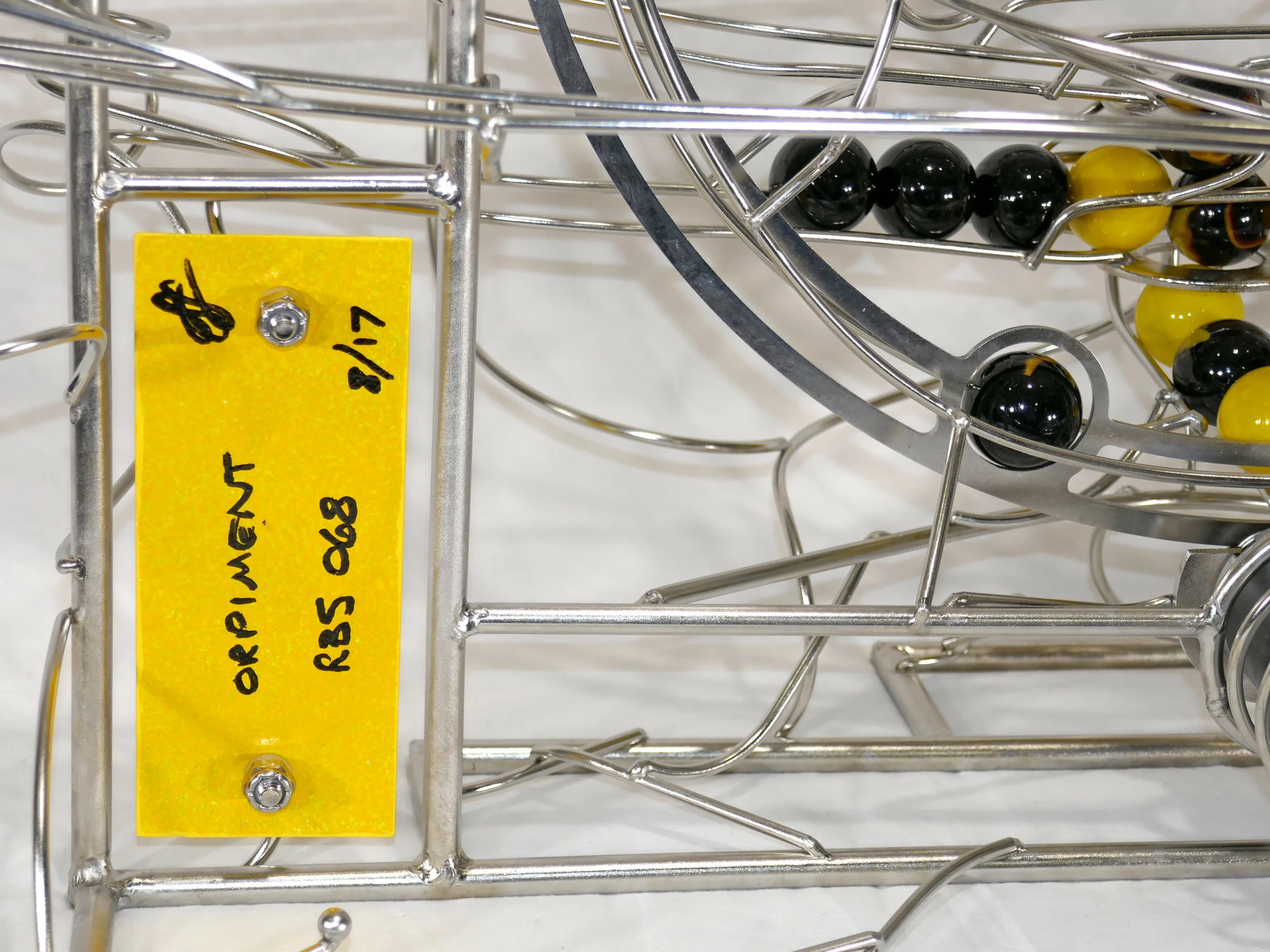 Rolling ball marble machine - close up of painted panel back side with written info