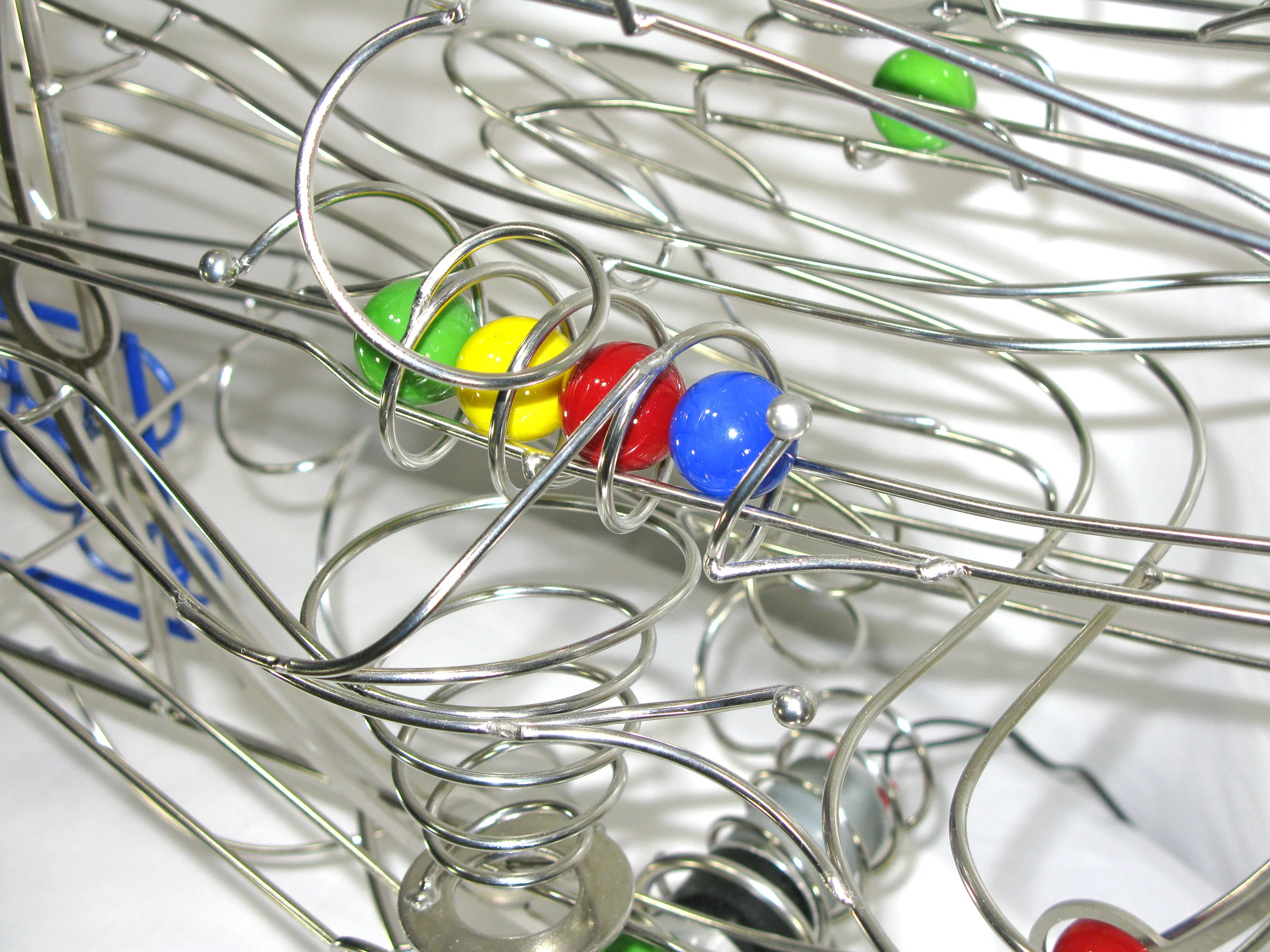 Rolling ball marble Sculptures - close up of energy transfer kinetic element