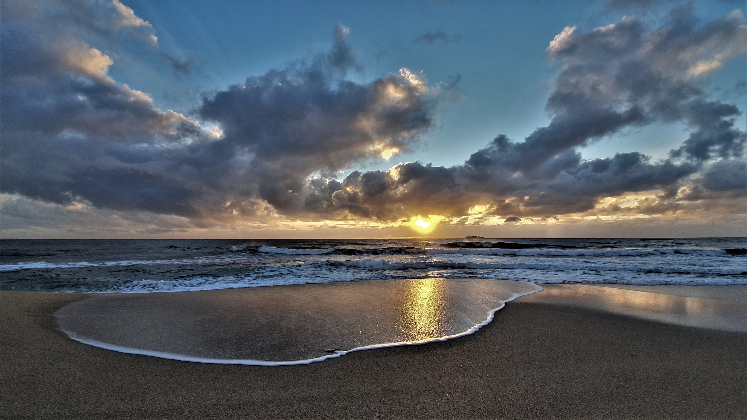 sunrise and water on sand Sue moxon.jpg