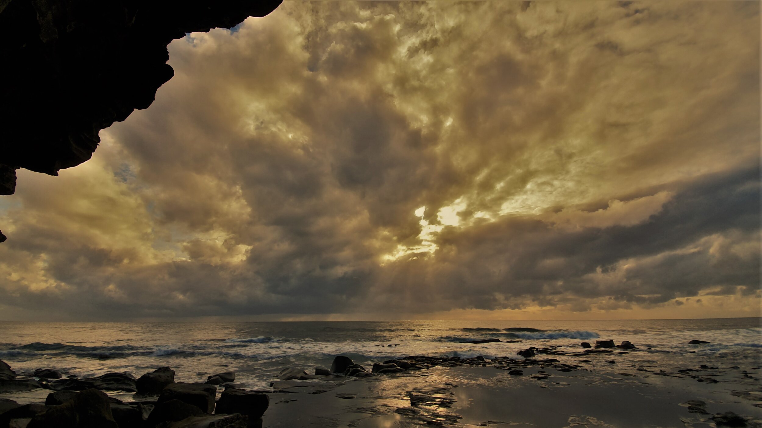 sunrise from cave at ocean sue moxon.jpg