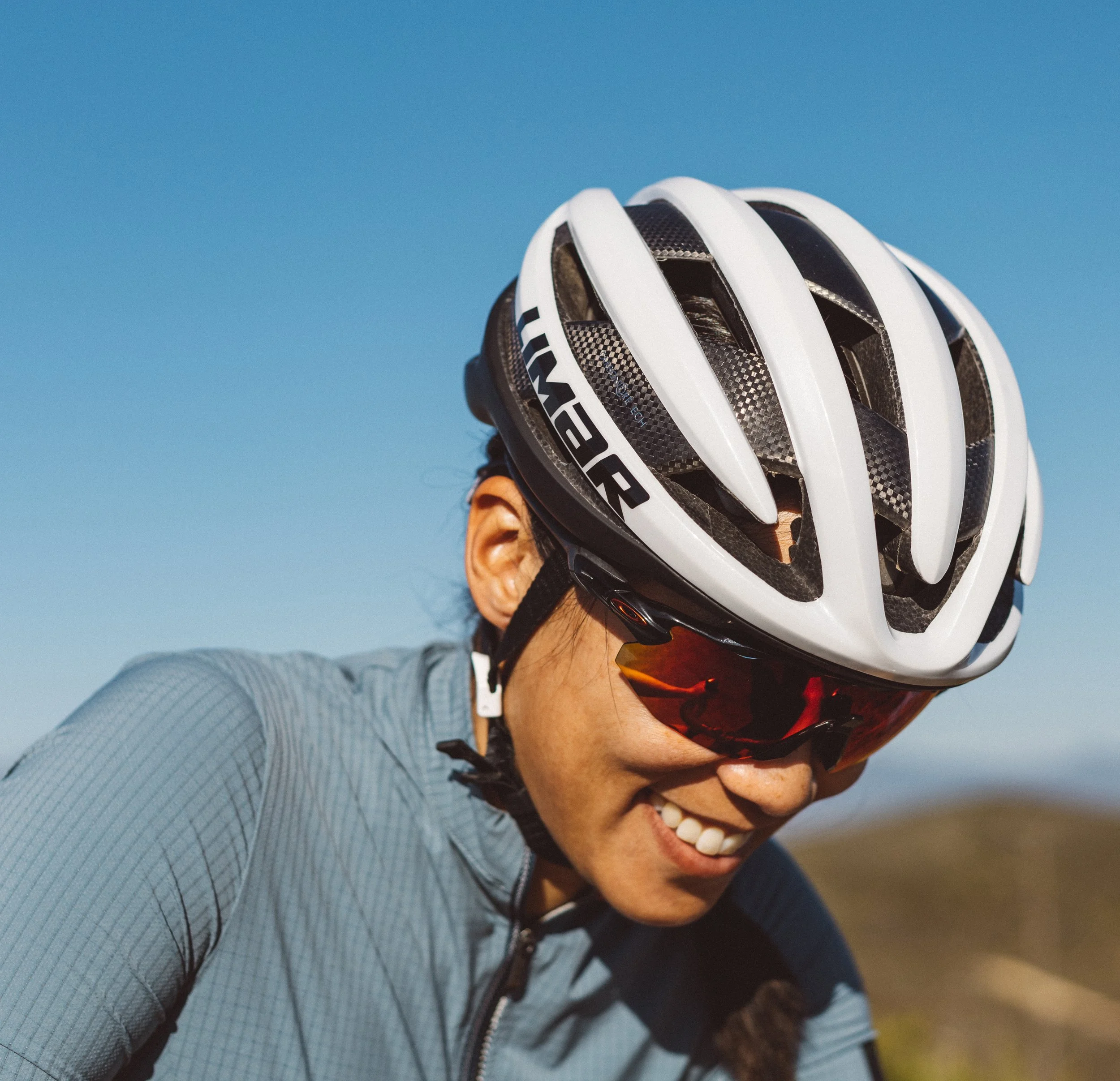 portrait photo of cyclist with a white helmet