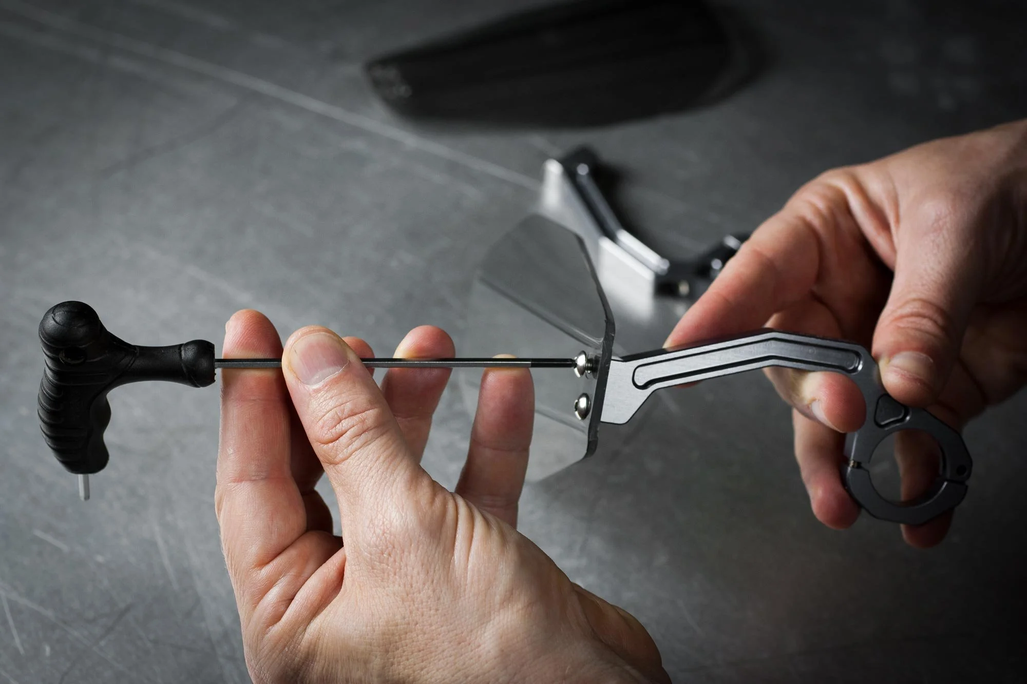 lifestyle photo of hands working on bike parts