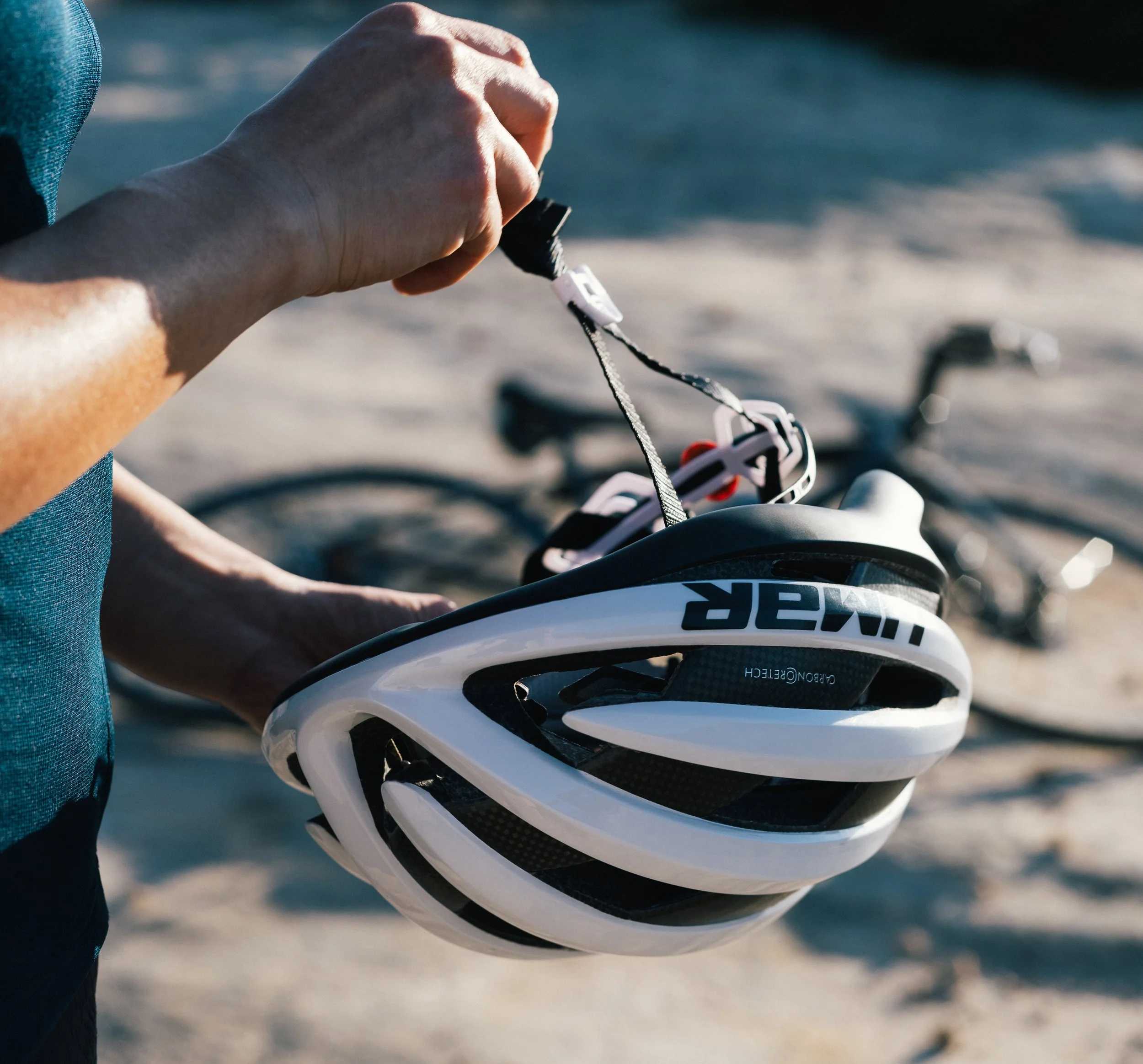 detail photo of cyclist's white helmet