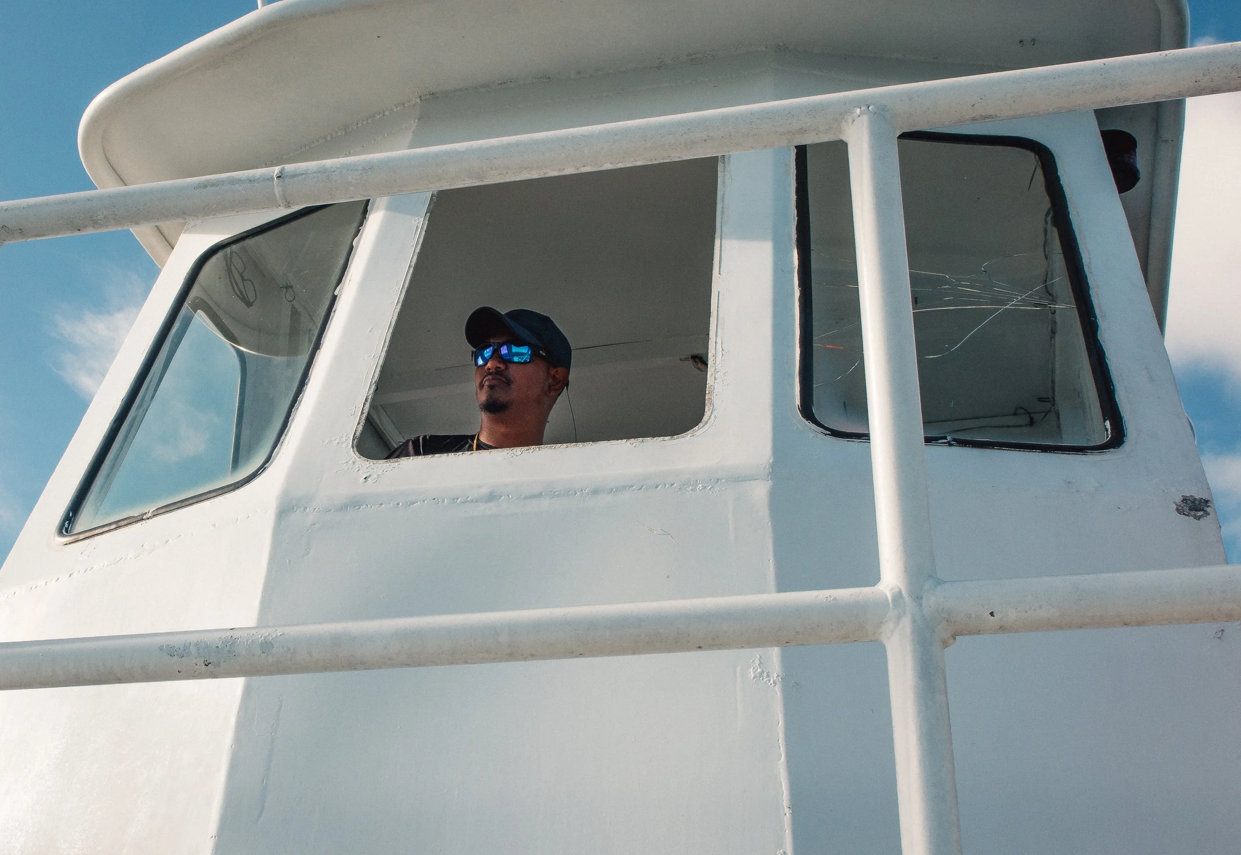 travel photo of captain steering his boat