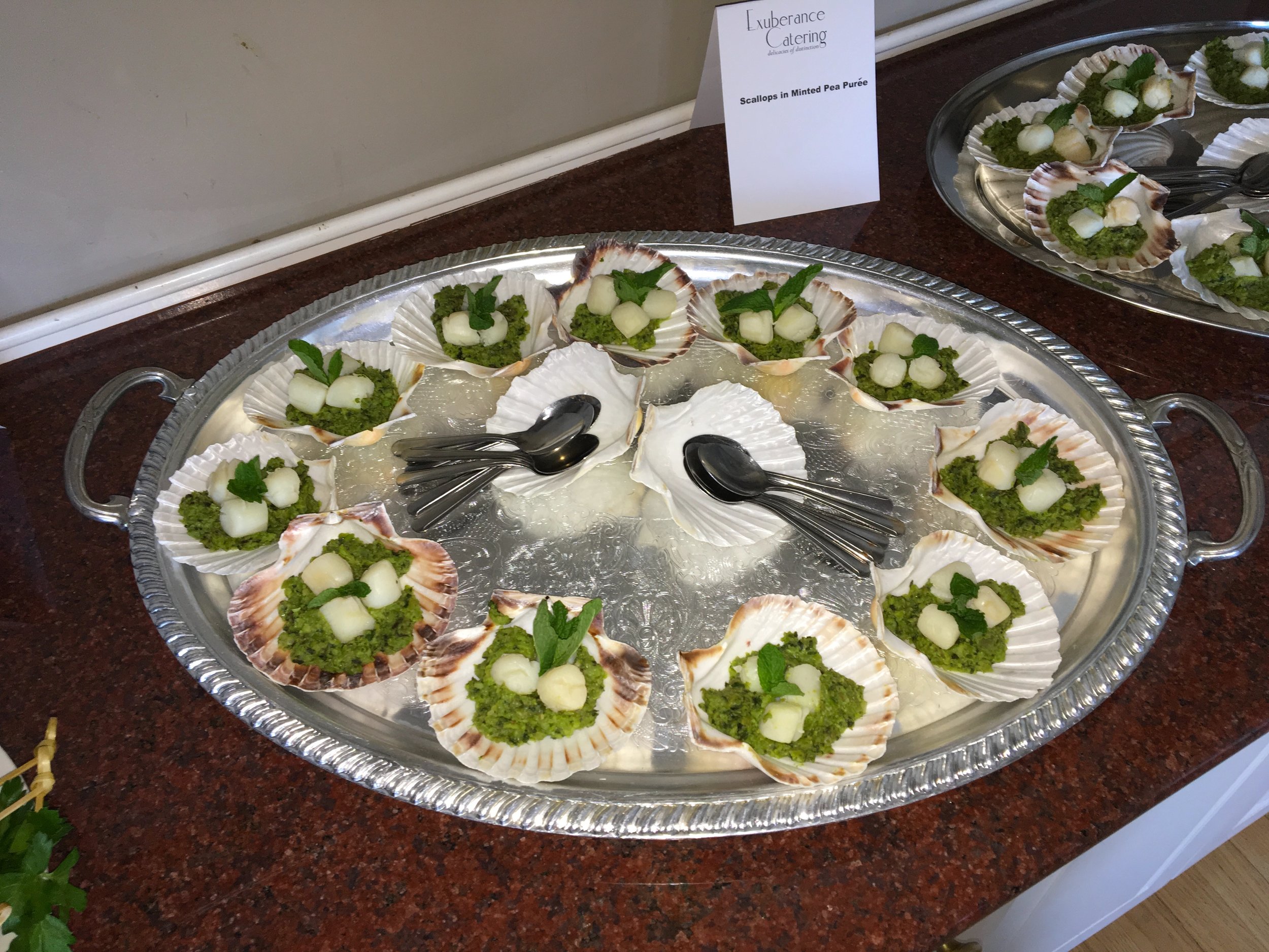 Scallops with minted pea puree in natural scallop shell