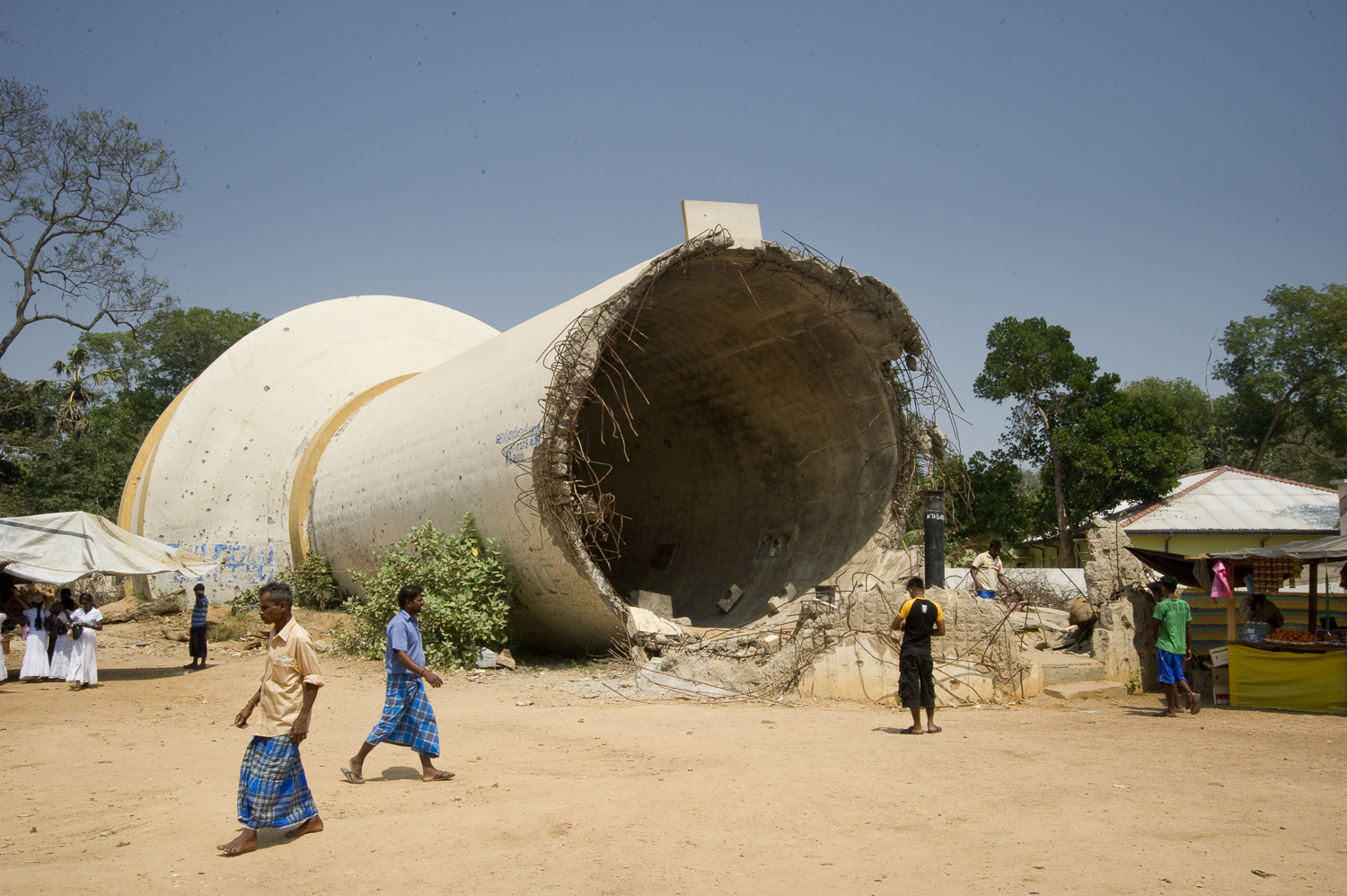  A toppled water tower in downtown Kilinochchi, once the Tamil Tigers administrative center. The Sri Lankan army and the Tigers accuse each other of destroying the tower. 