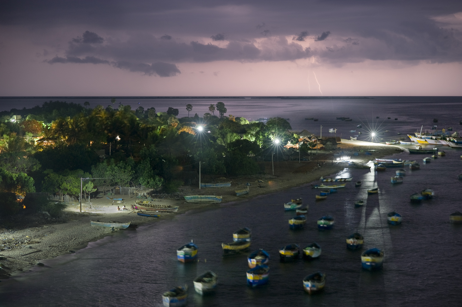  Thunderstorm clouds over a fishing village on Rameswaram island in the Palk strait. 