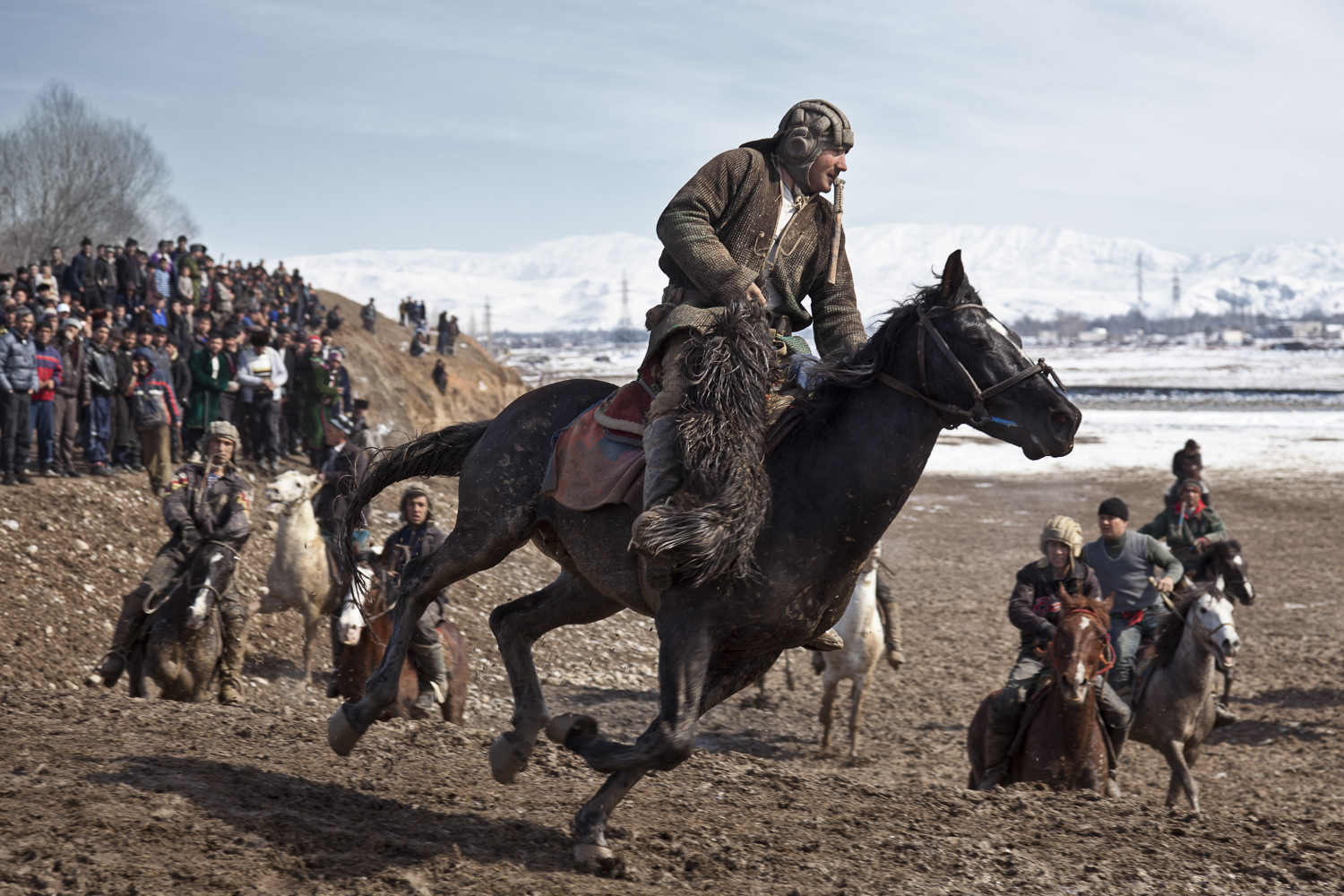  A buzkashi rider breaks free of the pack in a weekend match near Dushanbe, Tajikistan. 