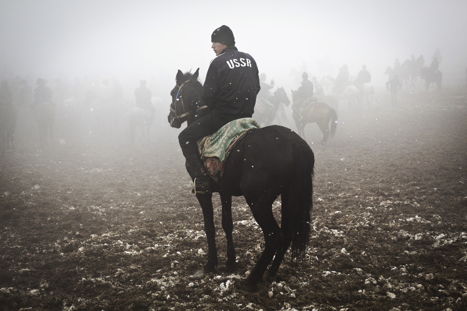  A buzkashi rider takes a break in the fog. 