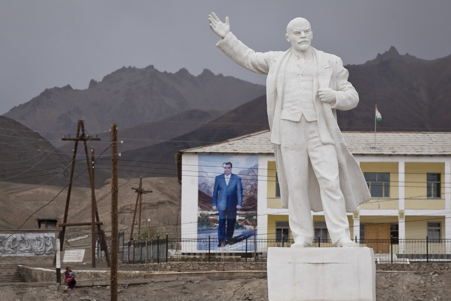  A building-size portrait of Tajik president Emomali Rahmon is dwarfed by a Soviet-era statue of Lenin in the eastern outpost of Murghab, in Tajikistan. 