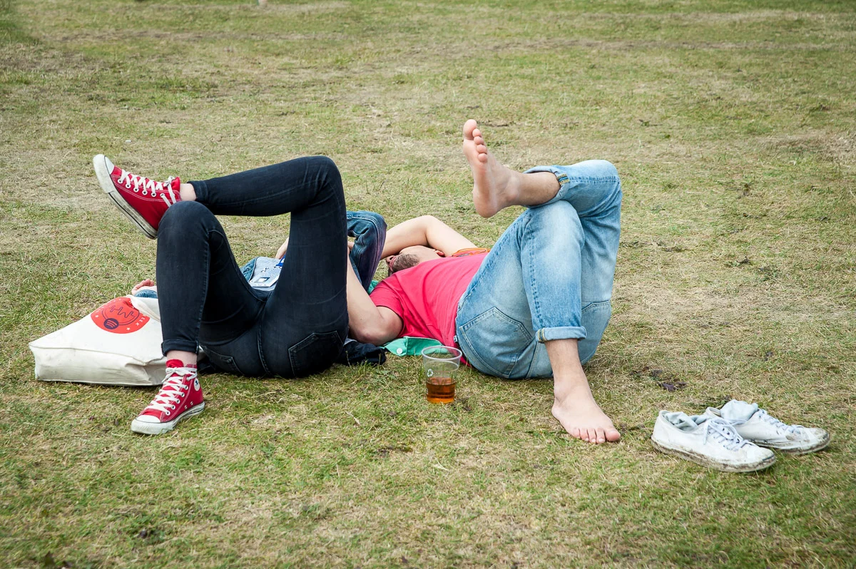 Festival goers lying on the grass, Field Day, Victoria Park, London, UK, 06/06/2015 © Dosfotos