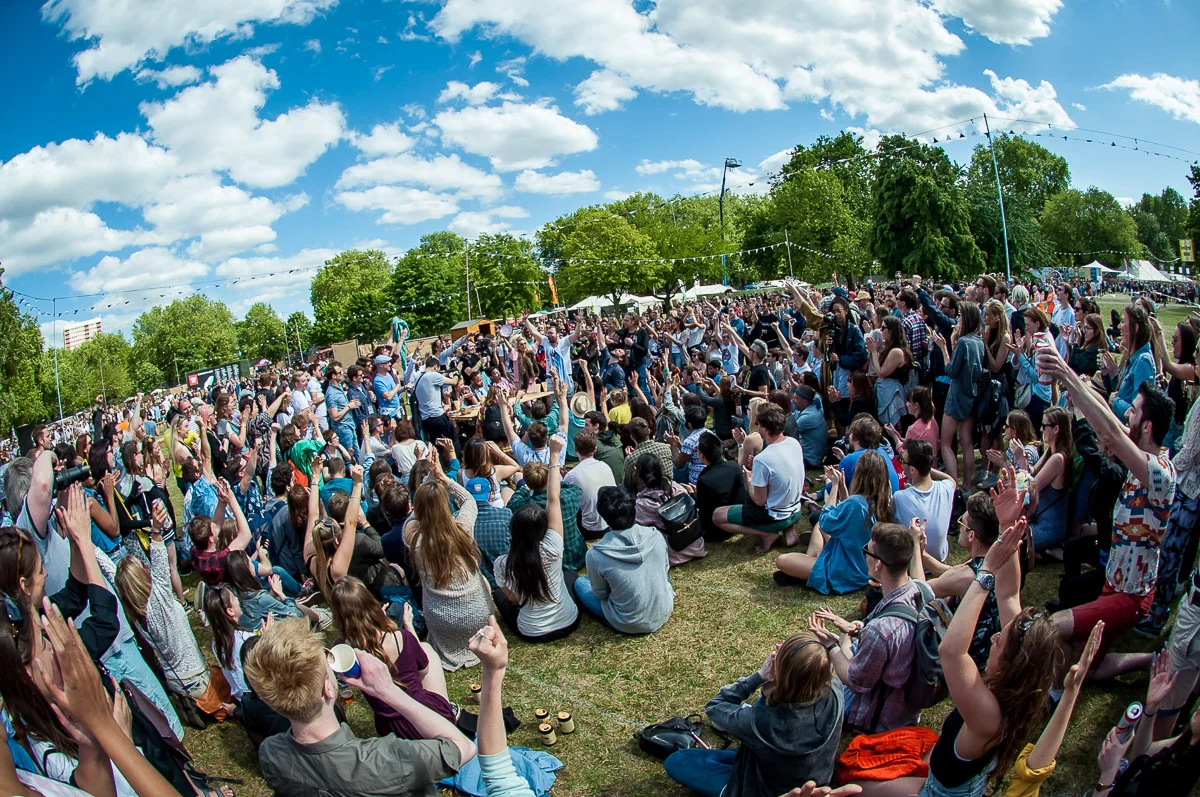 Festival goers taking part in a pie-eating contest, Field Day, Victoria Park, London, UK, 06/06/2015 © Dosfotos