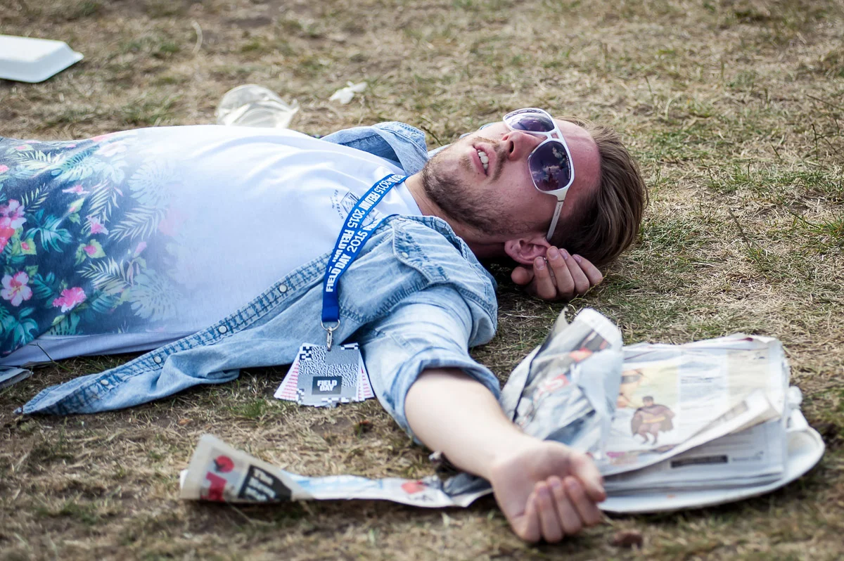 Festival goer sleeping, Field Day, Victoria Park, London, UK, 06/06/2015 © Dosfotos