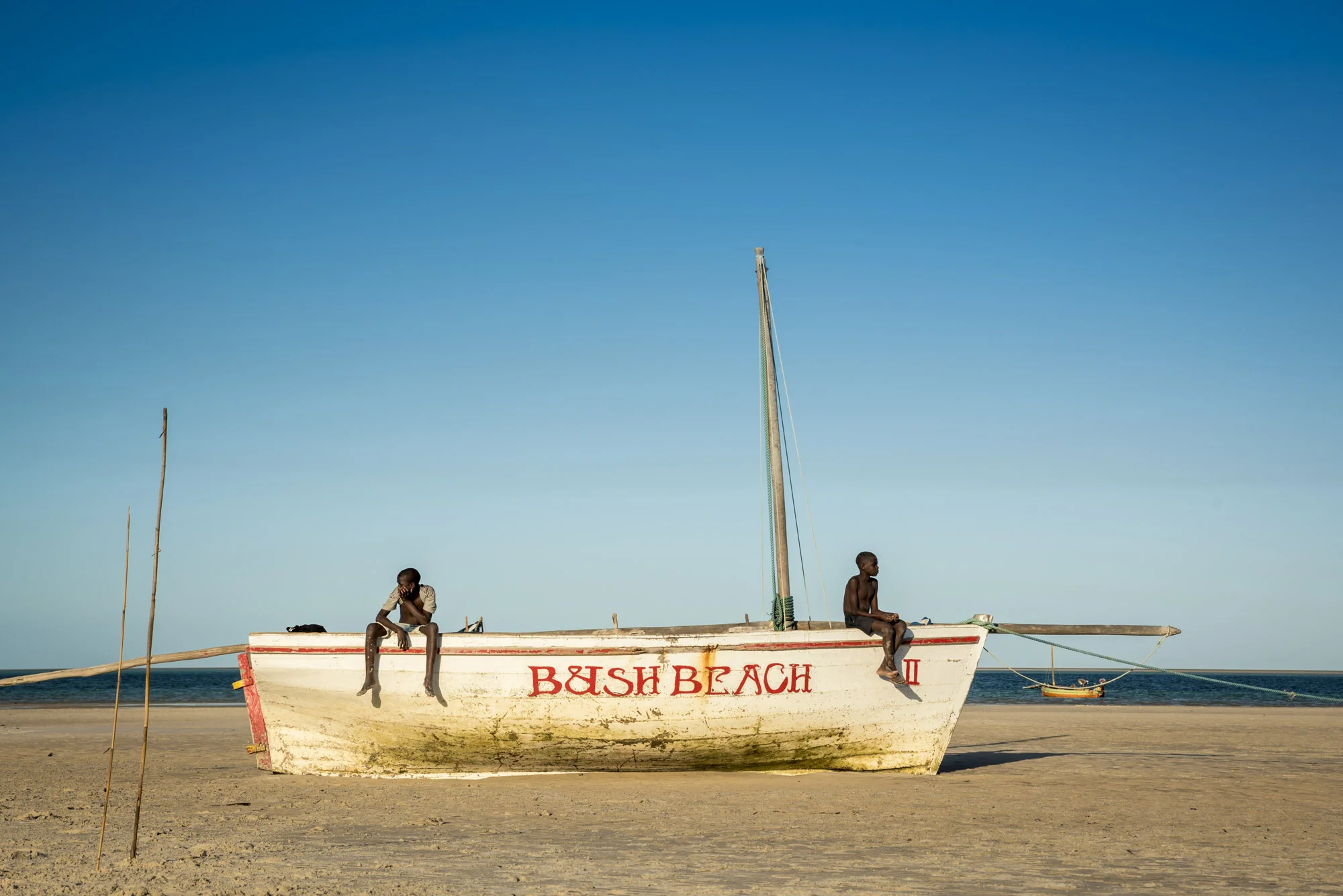 Local boys relaxing in a Dhow in Vilanculos beach during low tide, Bazaruto Archipelago, Mozambique, 24/08/2016 © Dosfotos