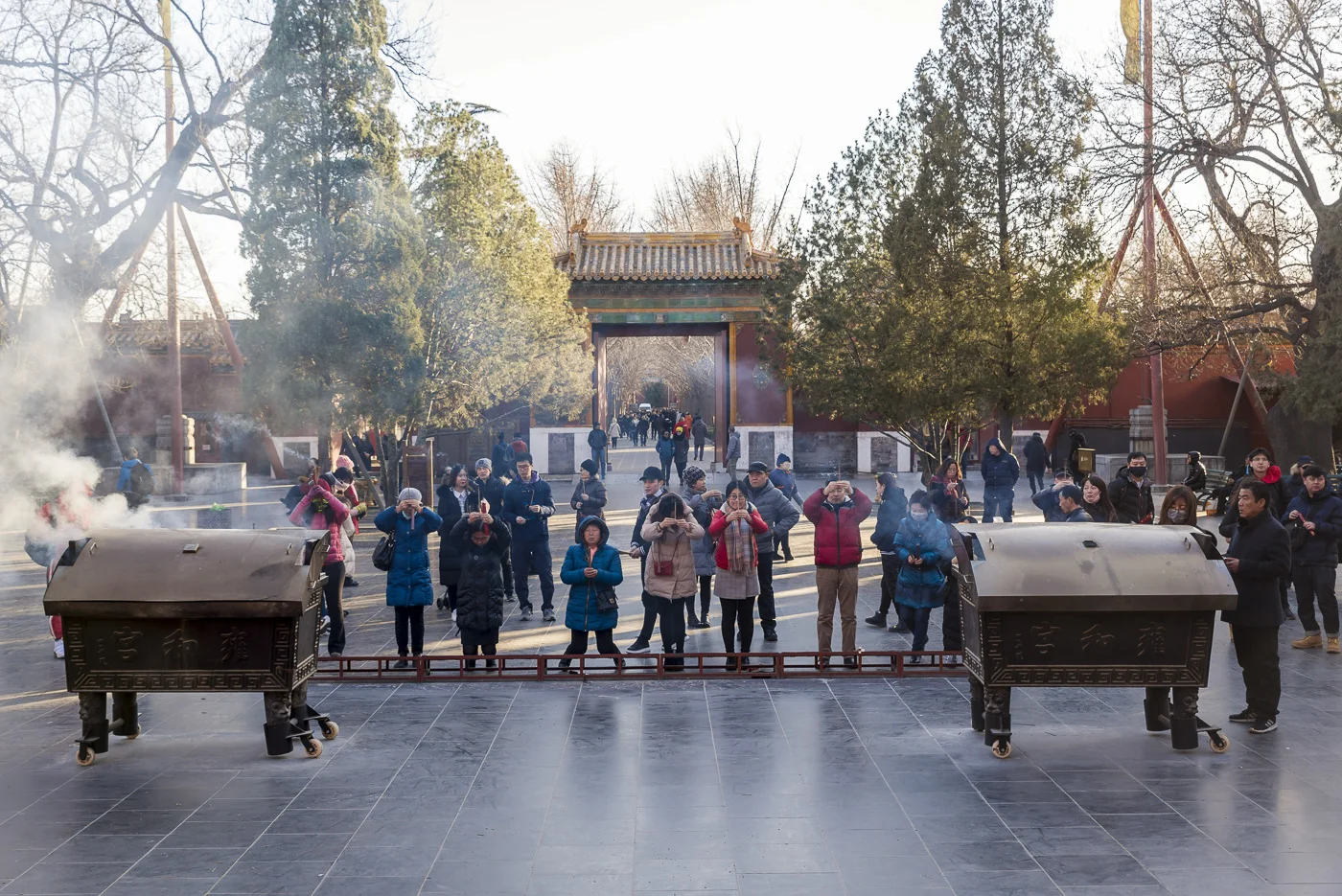 People praying at the Lama Temple, Dongcheng District, Beijing, China © Dosfotos