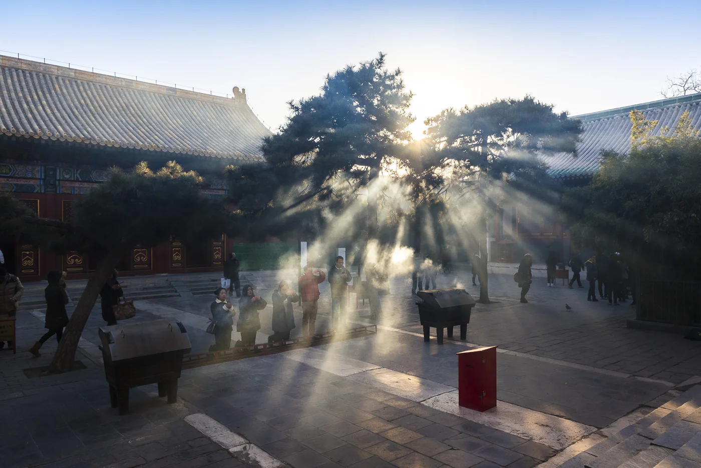 Sunlight through clouds of smoke, Lama Temple, Dongcheng District, Beijing, China © Dosfotos