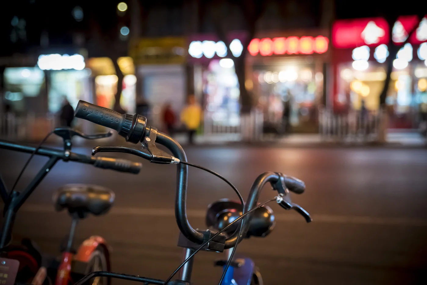 Bicycles and city lights, Beijing, China © Dosfotos
