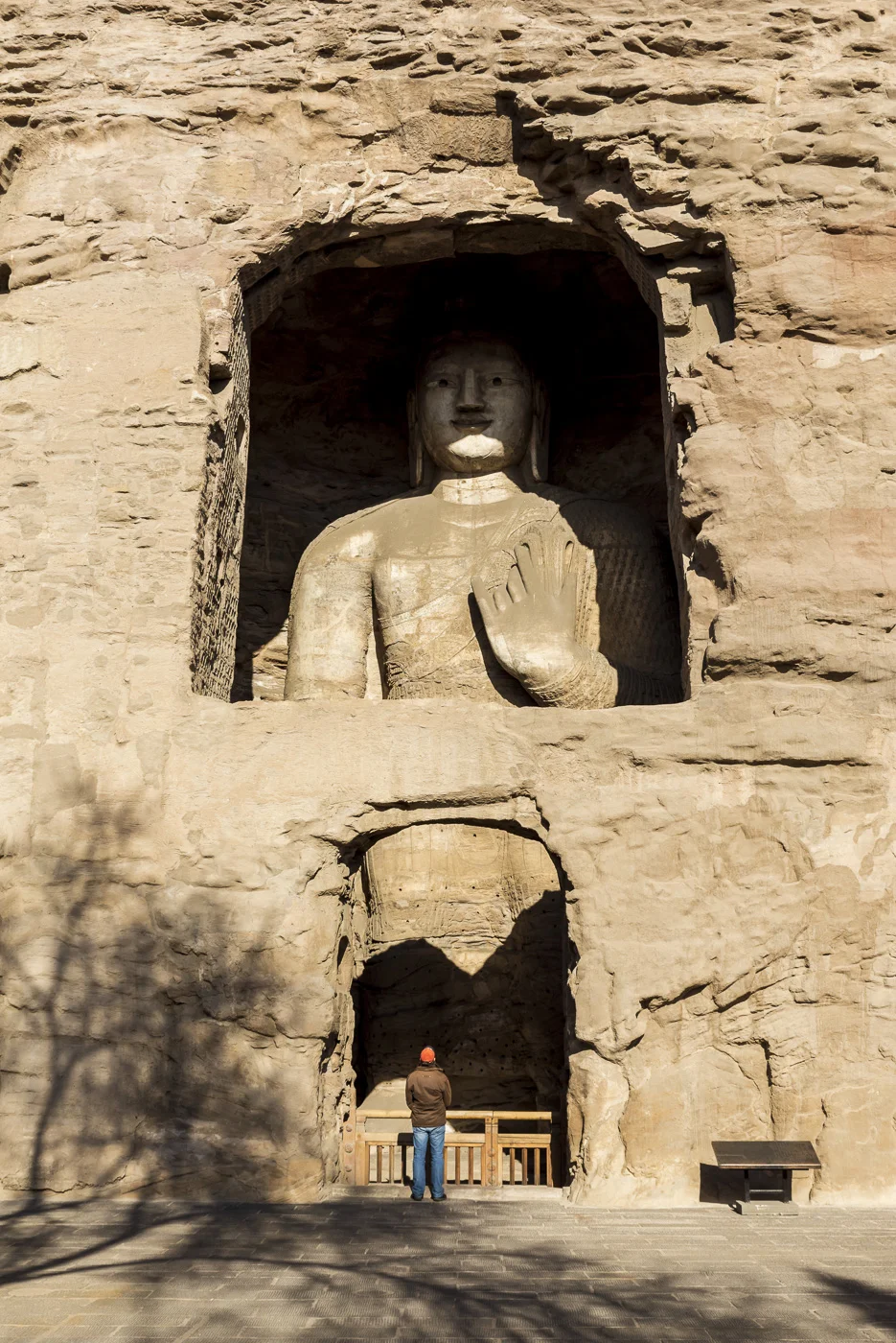 Carved Buddhist statues at Yungang Grottoes, ancient Chinese Buddhist temple grottoes near Datong, China © Dosfotos