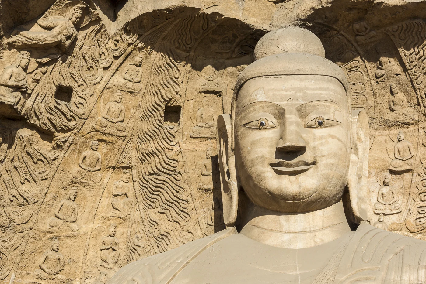 Carved Buddhist statues at Yungang Grottoes, ancient Chinese Buddhist temple grottoes near Datong, China © Dosfotos