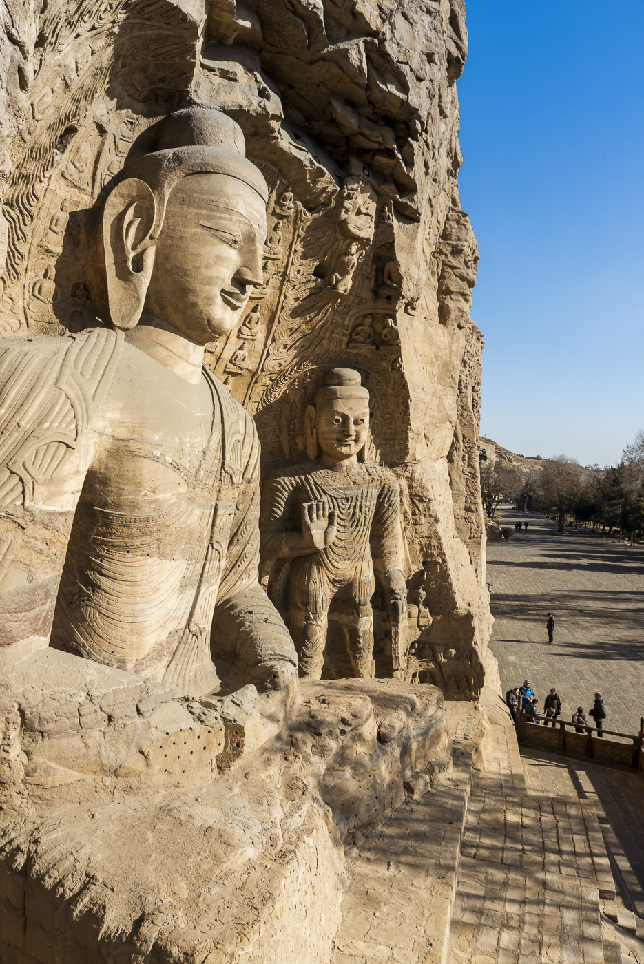 Carved Buddhist statues at Yungang Grottoes, ancient Chinese Buddhist temple grottoes near Datong, China © Dosfotos