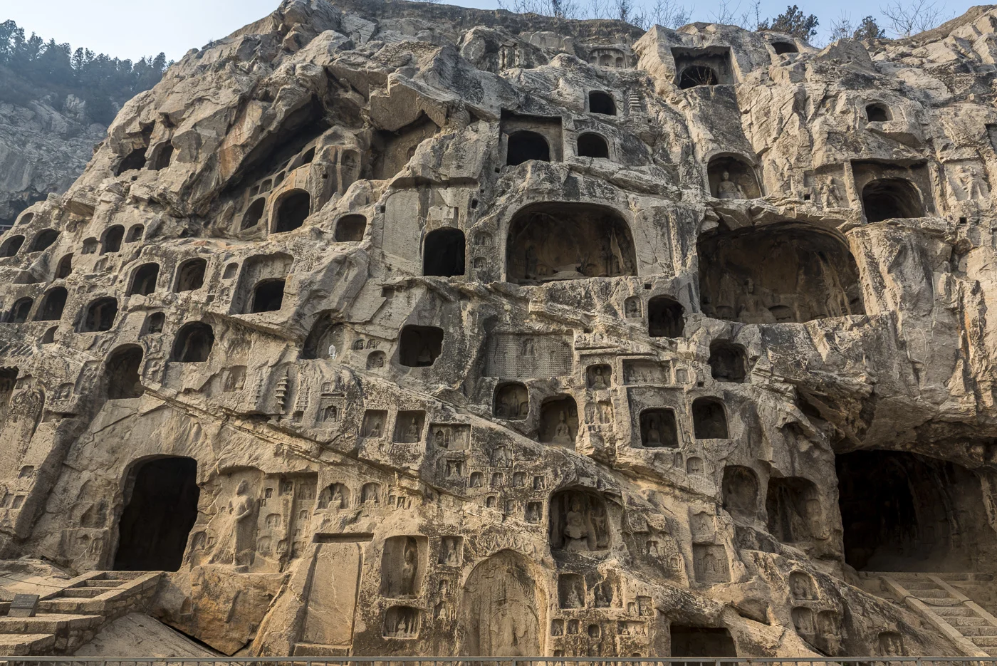 The Longmen Caves, some of the finest examples of Chinese Buddhist art housing tens of thousands of statues of Buddha and his disciples, Luoyang, Henan Province, China © Dosfotos