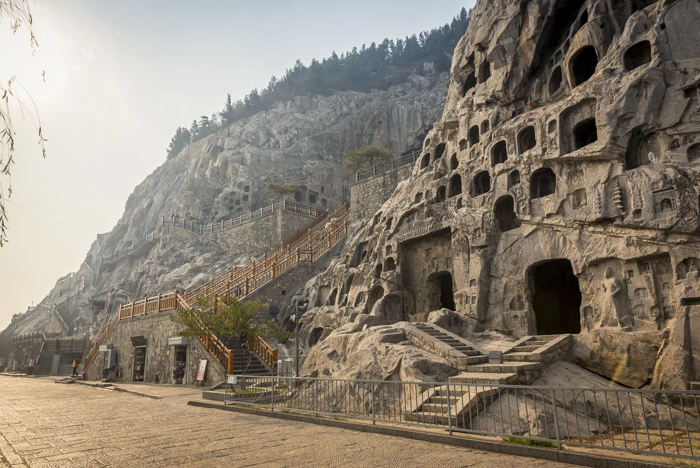 The Longmen Caves, some of the finest examples of Chinese Buddhist art housing tens of thousands of statues of Buddha and his disciples, Luoyang, Henan Province, China © Dosfotos