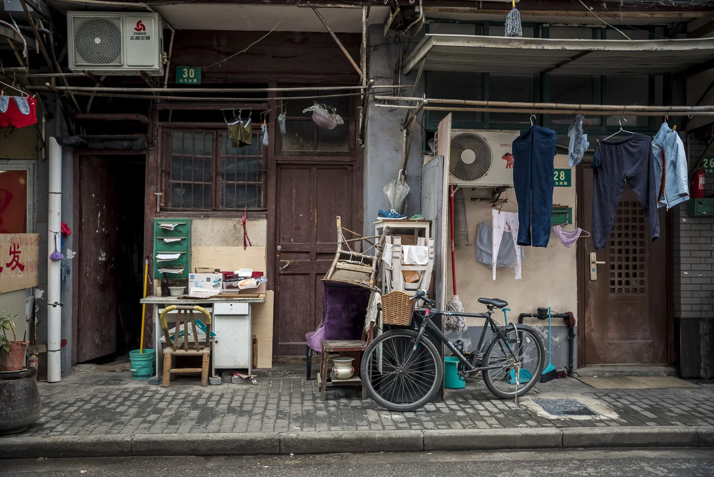 Clothes line and bicyckes around Nanjing Road, Huangpu District, Shanghai, China © Dosfotos