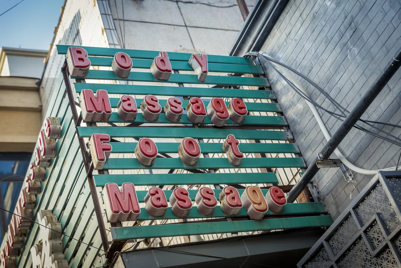 A massage sign in a hutong, Beijing, China © Dosfotos