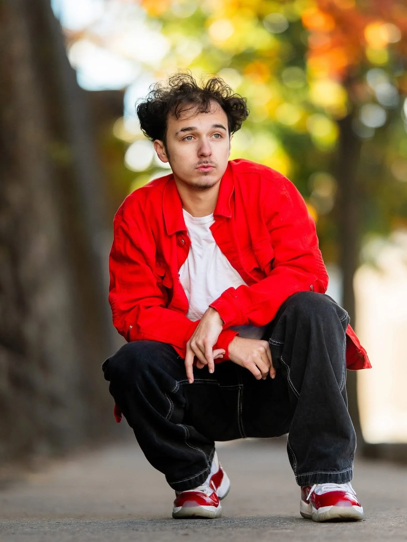 Gaige crushed this chilly morning downtown senior session &mdash; that red jacket was everything! 🔥