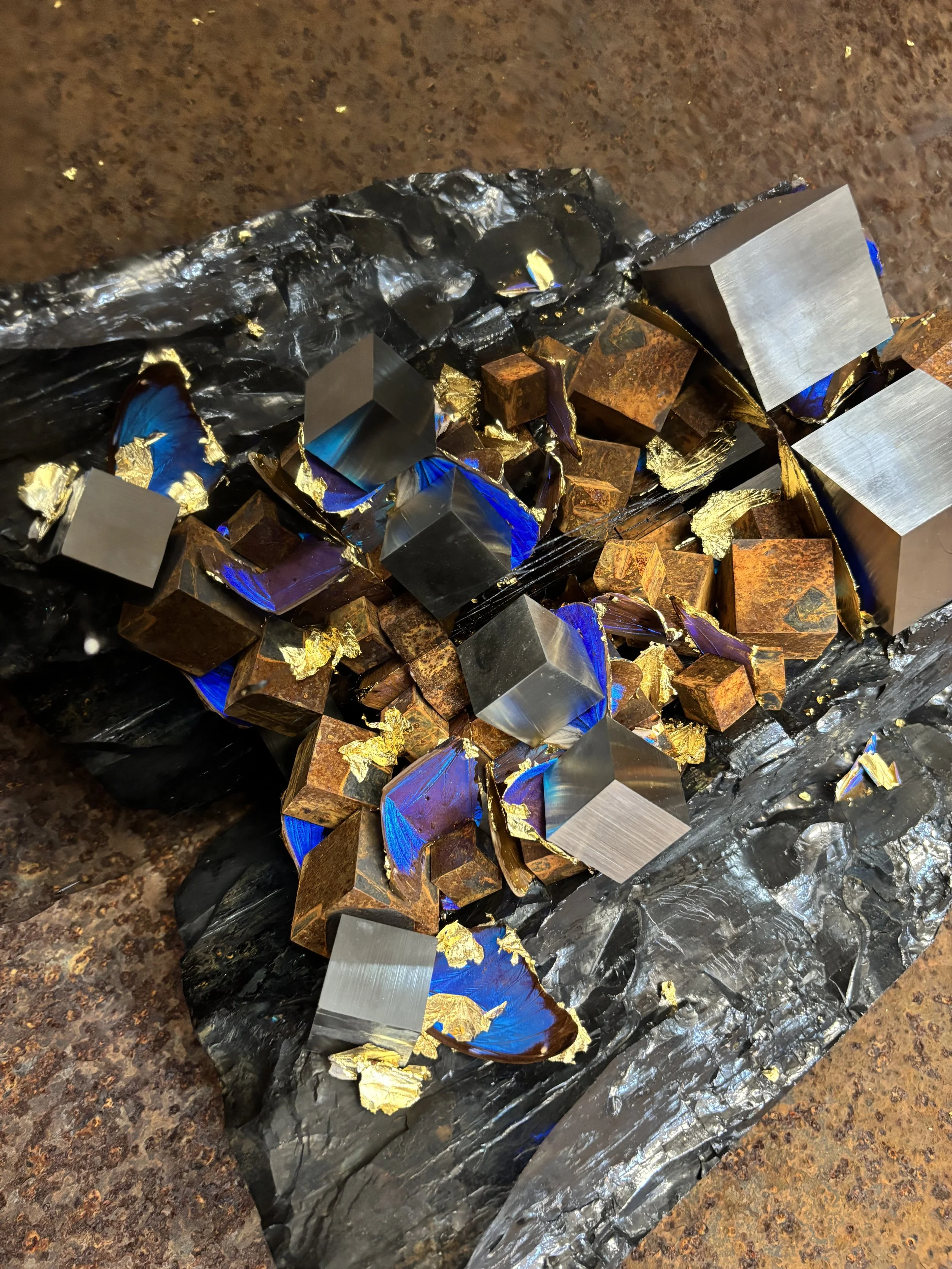 "Carbon Mirror on Disc", 2025, 46"x42"x42", anthracite, steel, stainless steel, gold leafed wings of Morpho aega and Morpho anaxibia