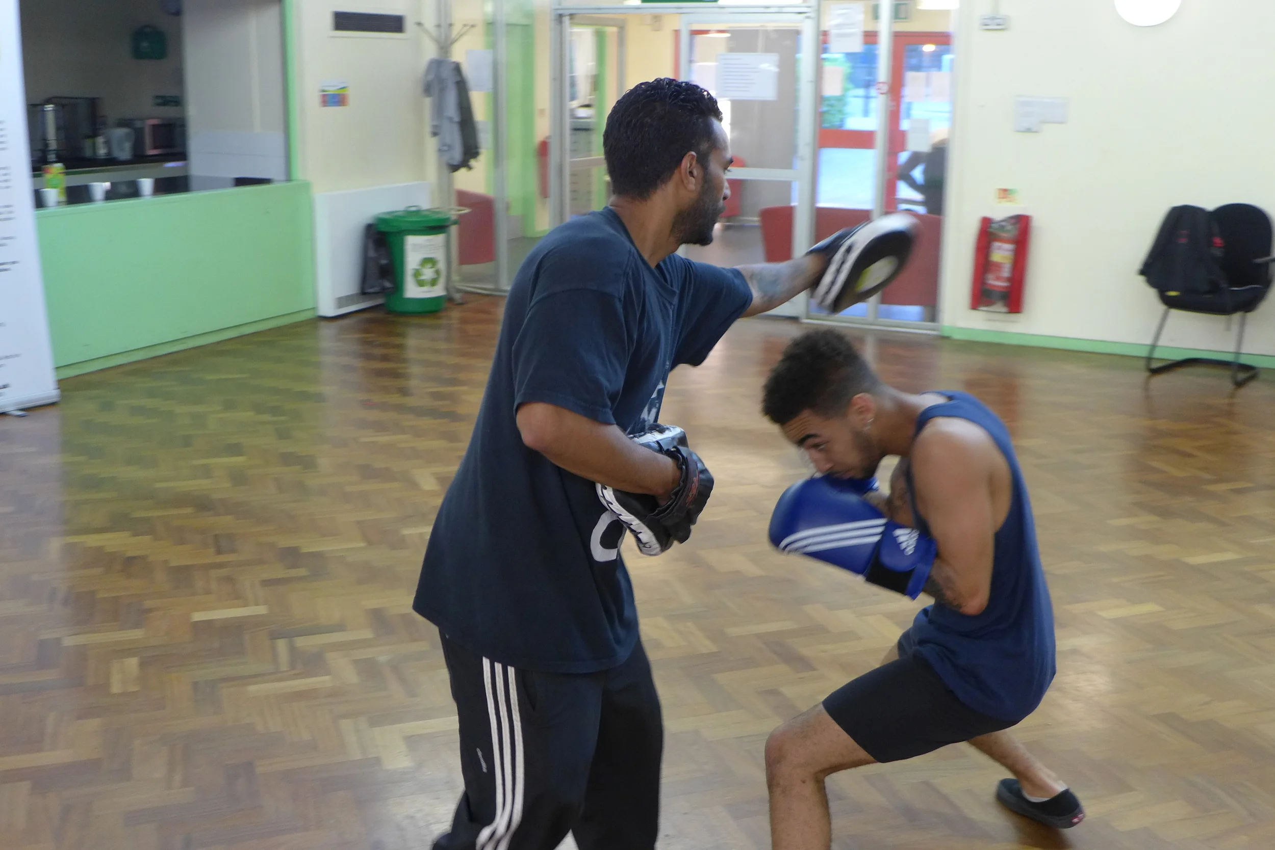 Student sparring with Boxing Trainer