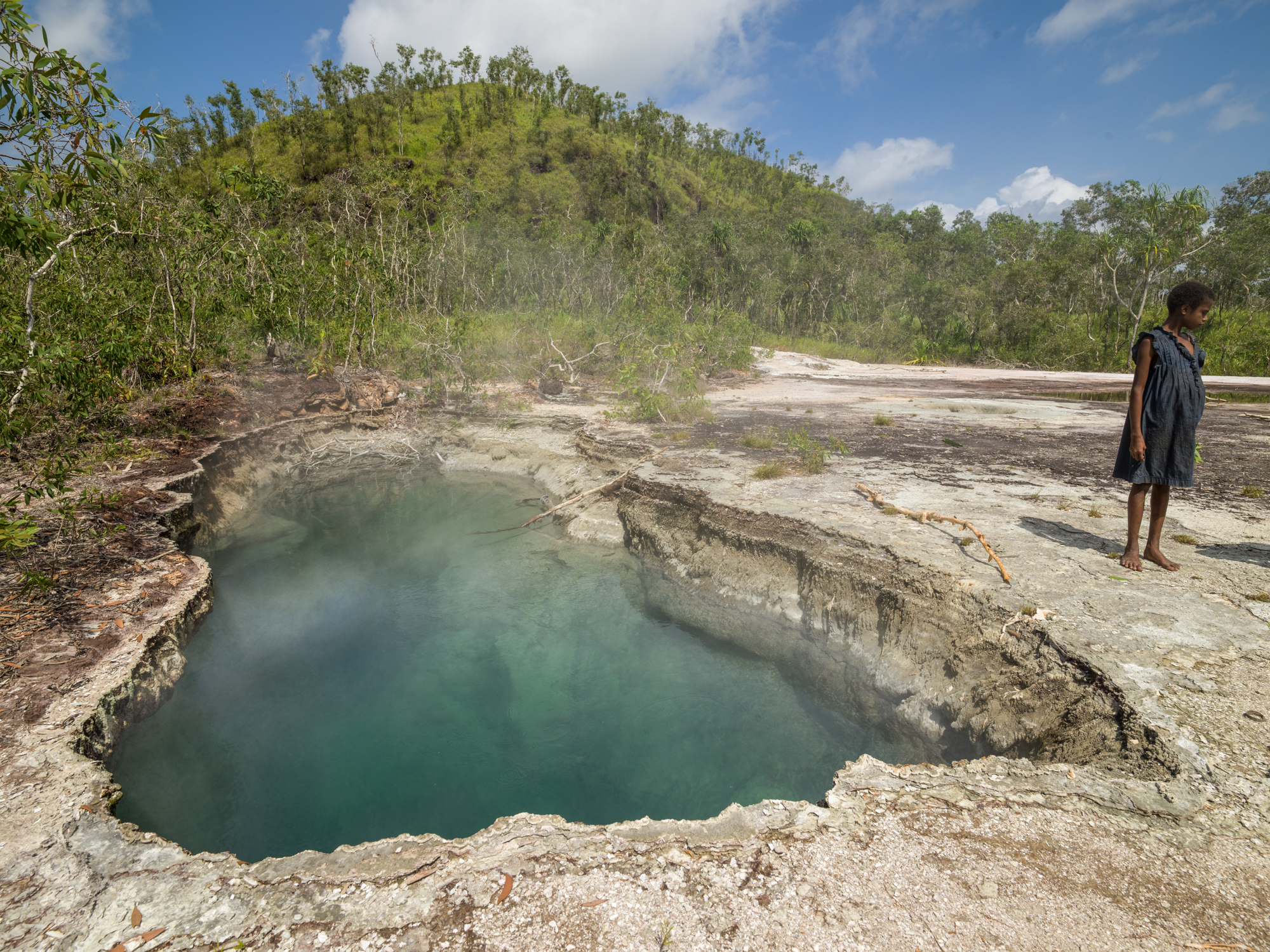   Geothermal pool, Fergusson Island, Papua New Guinea -  Though the volcanic activity is extinct, Fergusson Island has many geysers, hot springs and mud pools.  The boiling pools like this one are used by the locals to cook food wrapped in pandanus a