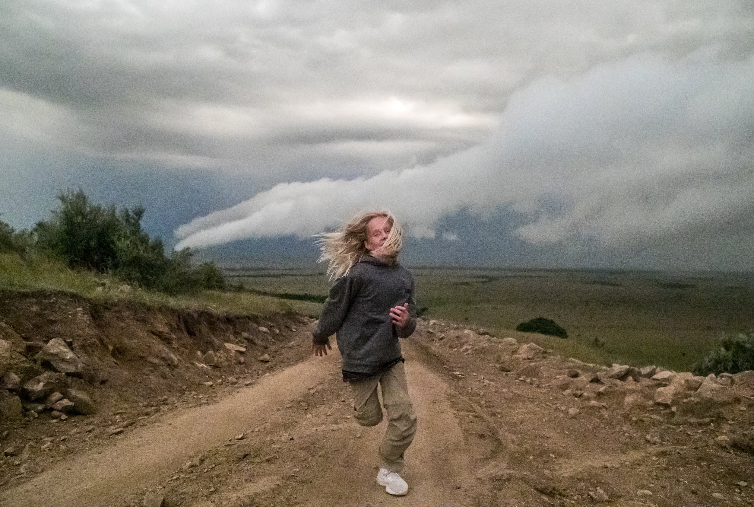   Masai Mara, Kenya, 2018 -  Running in a storm on return from safari.  
