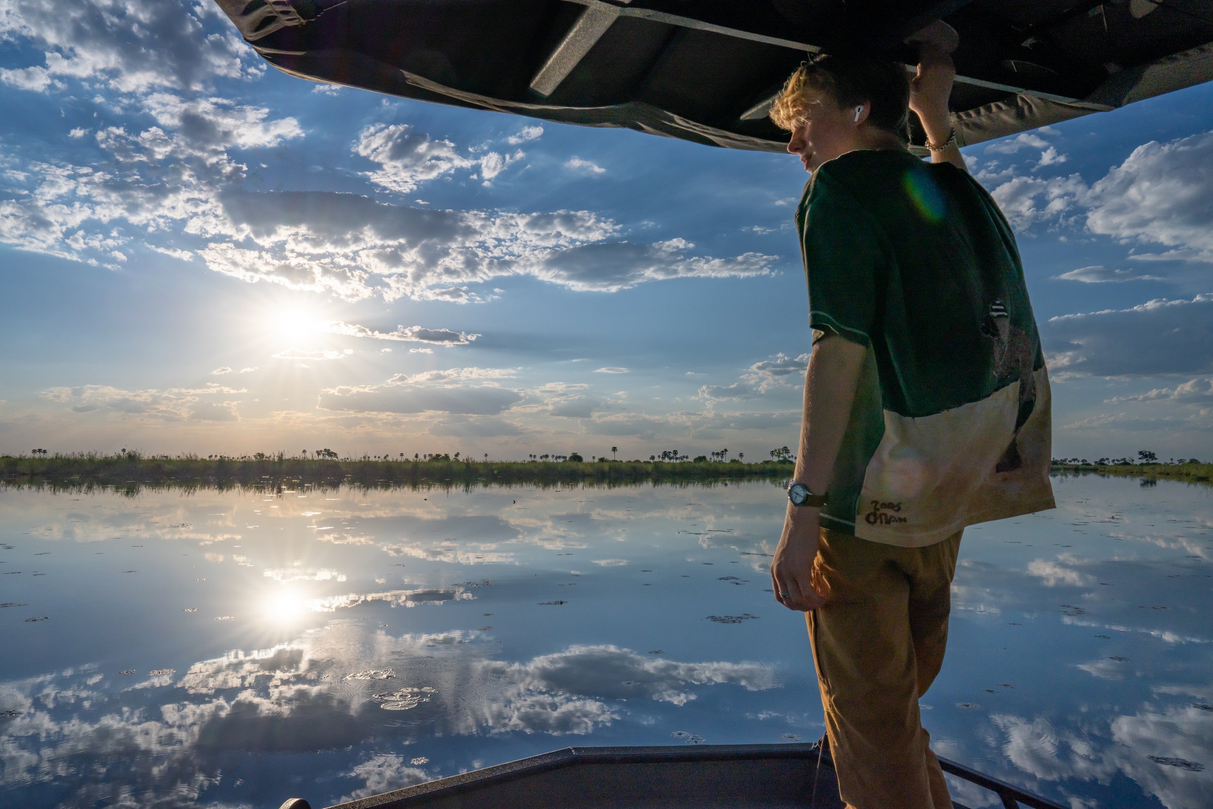  Botswana, 2021  -  Returning to camp one evening on a boat safari through the Savuti Channel of the Linyanti River in Northern Botswana.  