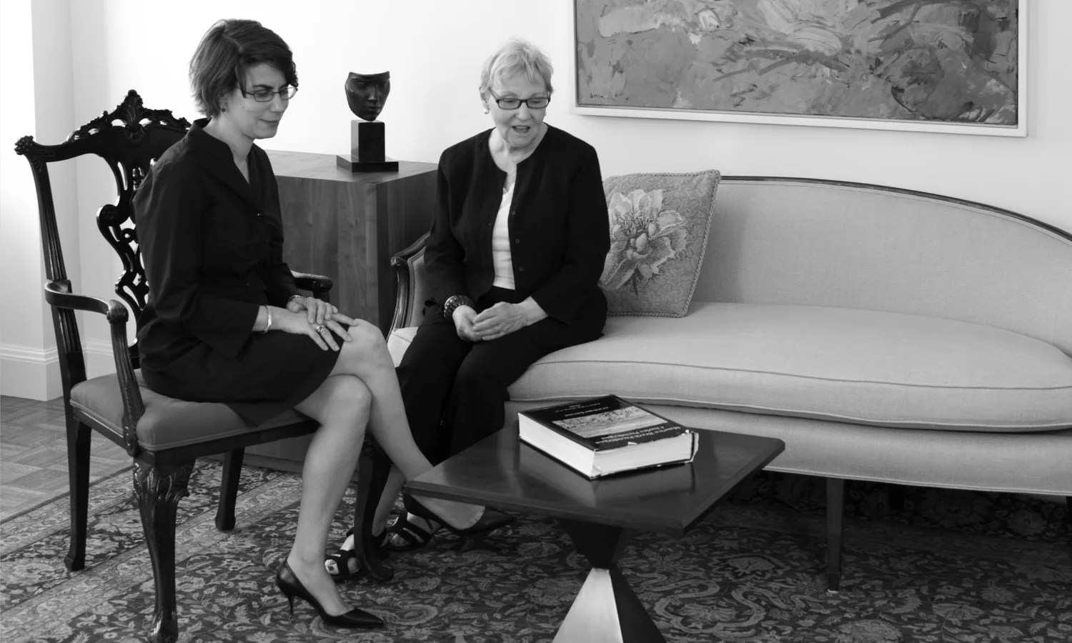Photograph of Katherine Degn and Carole Pesner sitting, 74 East 79th Street, 2010