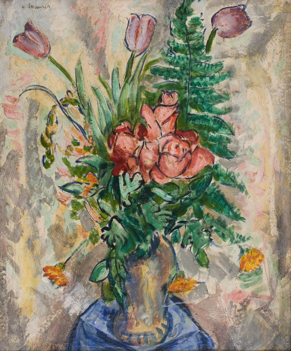 Red and yellow flowers in vase on blue table