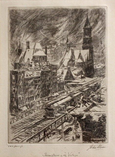 Train driving through the center of a snowy village (buildings on top left and bottom right)