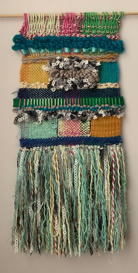 Oceana. Woven collage of different textures wall hanging. Blue, green and teal tones